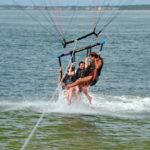 3 People Parasailing - dip in the ocean