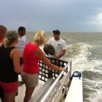 Tour guide holding horseshoe crab